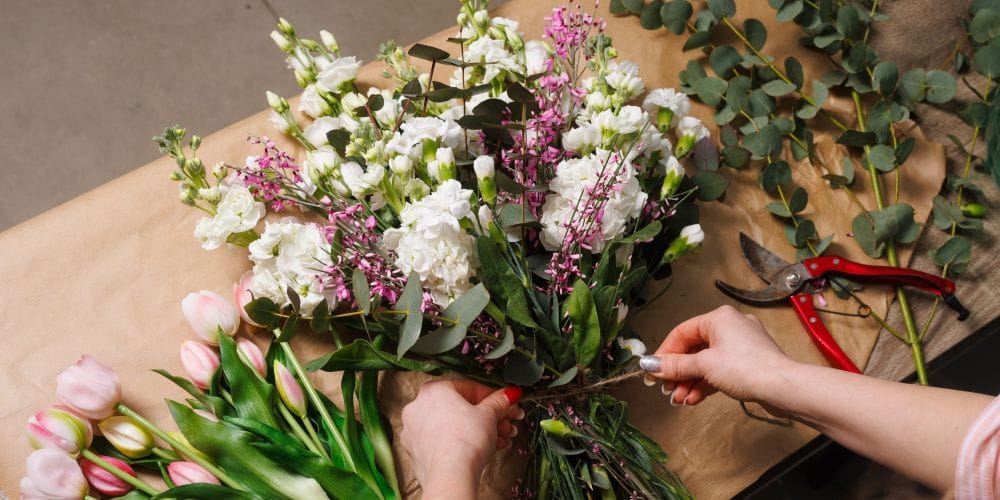 Florist designing a bouquet of flowers.