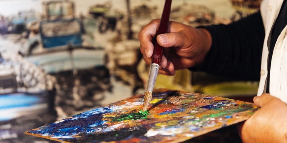 Artist mixing paint.
