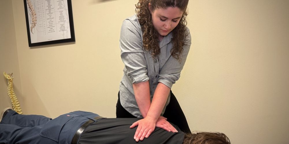 Chiropractor giving a patient an adjustment.