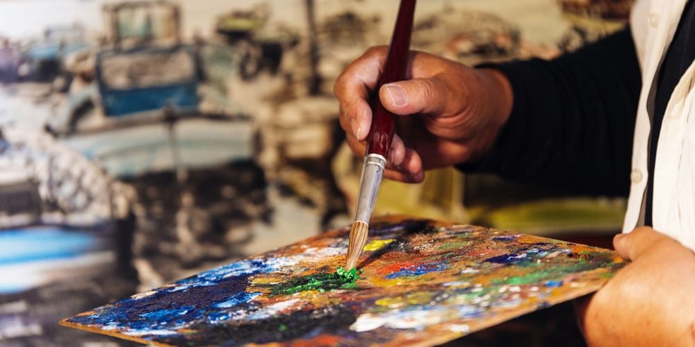 Artist mixing paint.